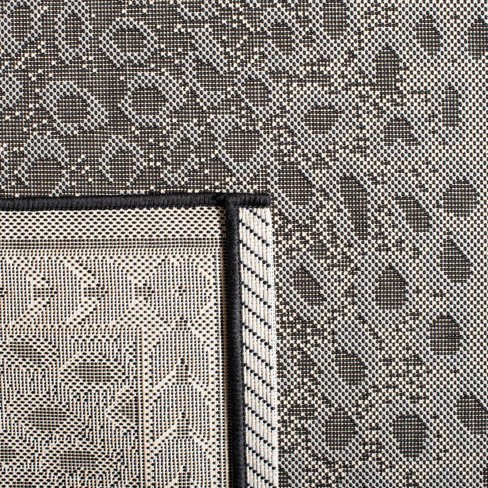 Gray and Black Spotted Synthetic Indoor/Outdoor Area Rug, 9' x 12'