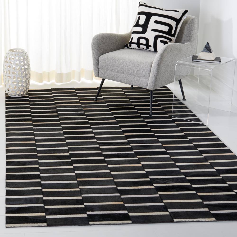 Hand-Knotted Black and Beige Geometric Cowhide Rug