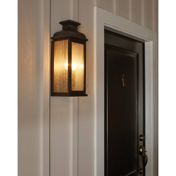 Generation Lighting - Pediment 8 in. W 3-Light Dark Weathered Zinc Outdoor 23.875 in. Wall Lantern Sconce with Clear Seeded Glass