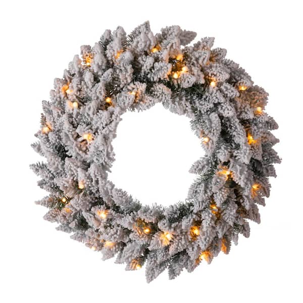 Glitzhome 24 in. D Pre-Lit Snow Flocked Artificial Christmas Wreath with Warm White LED Light