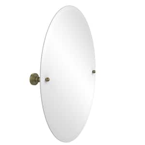 Waverly Place Collection 21 in. x 29 in. Frameless Oval Single Tilt Mirror with Beveled Edge in Antique Brass