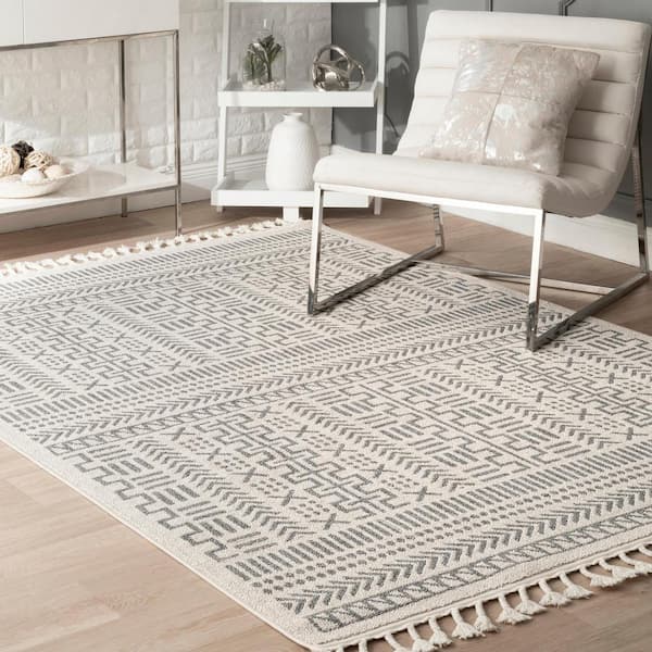https://images.thdstatic.com/productImages/22469ebb-330f-493c-9cd3-d73b4c16dec2/svn/beige-nuloom-outdoor-rugs-acnz08a-6709-e1_600.jpg
