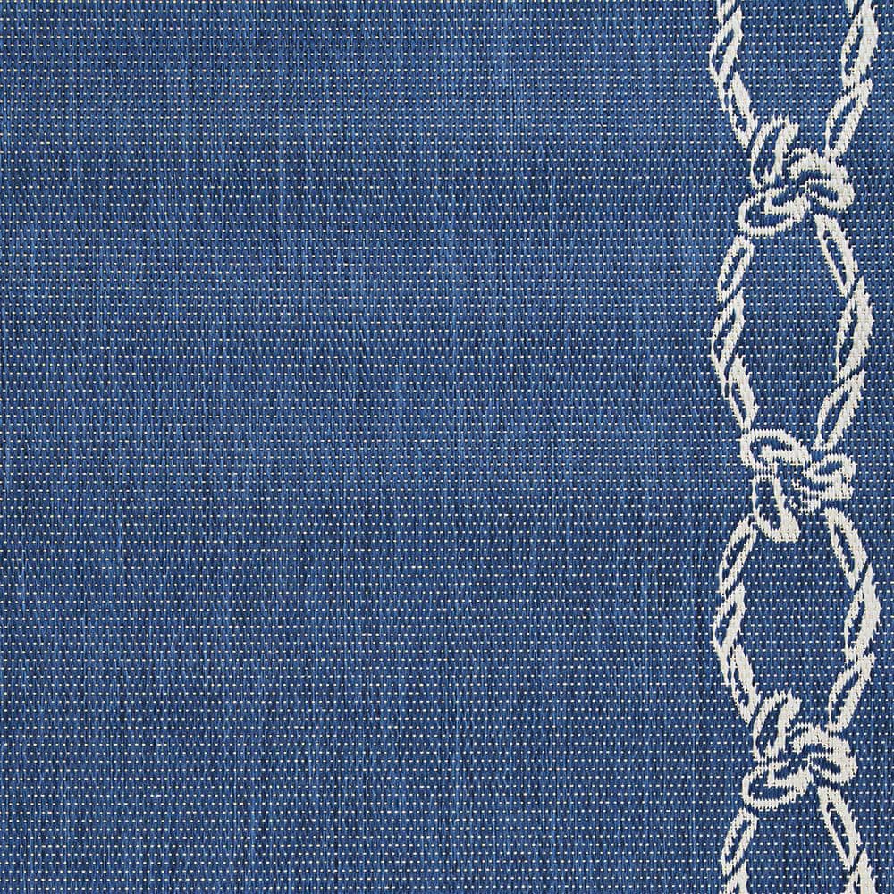 Ivory and Indigo Round Synthetic Indoor/Outdoor Area Rug