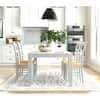 Vera Whitewash Parsons Chairs in a kitchen dining setting