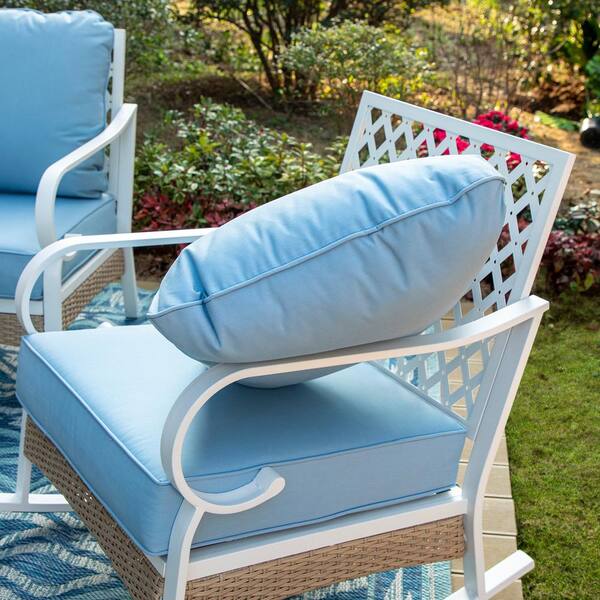 White patio furniture shop with blue cushions