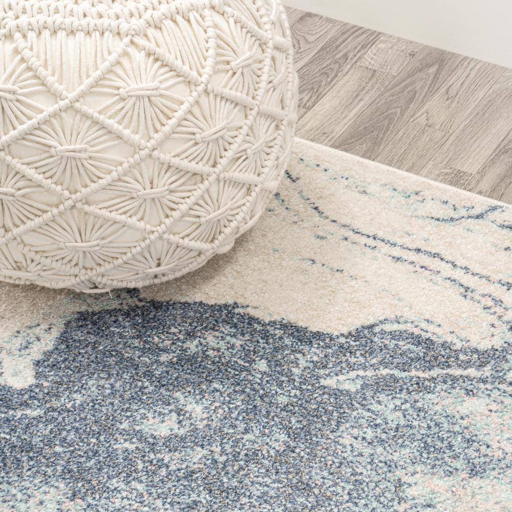 Blue and Cream Abstract 8' x 10' Synthetic Area Rug