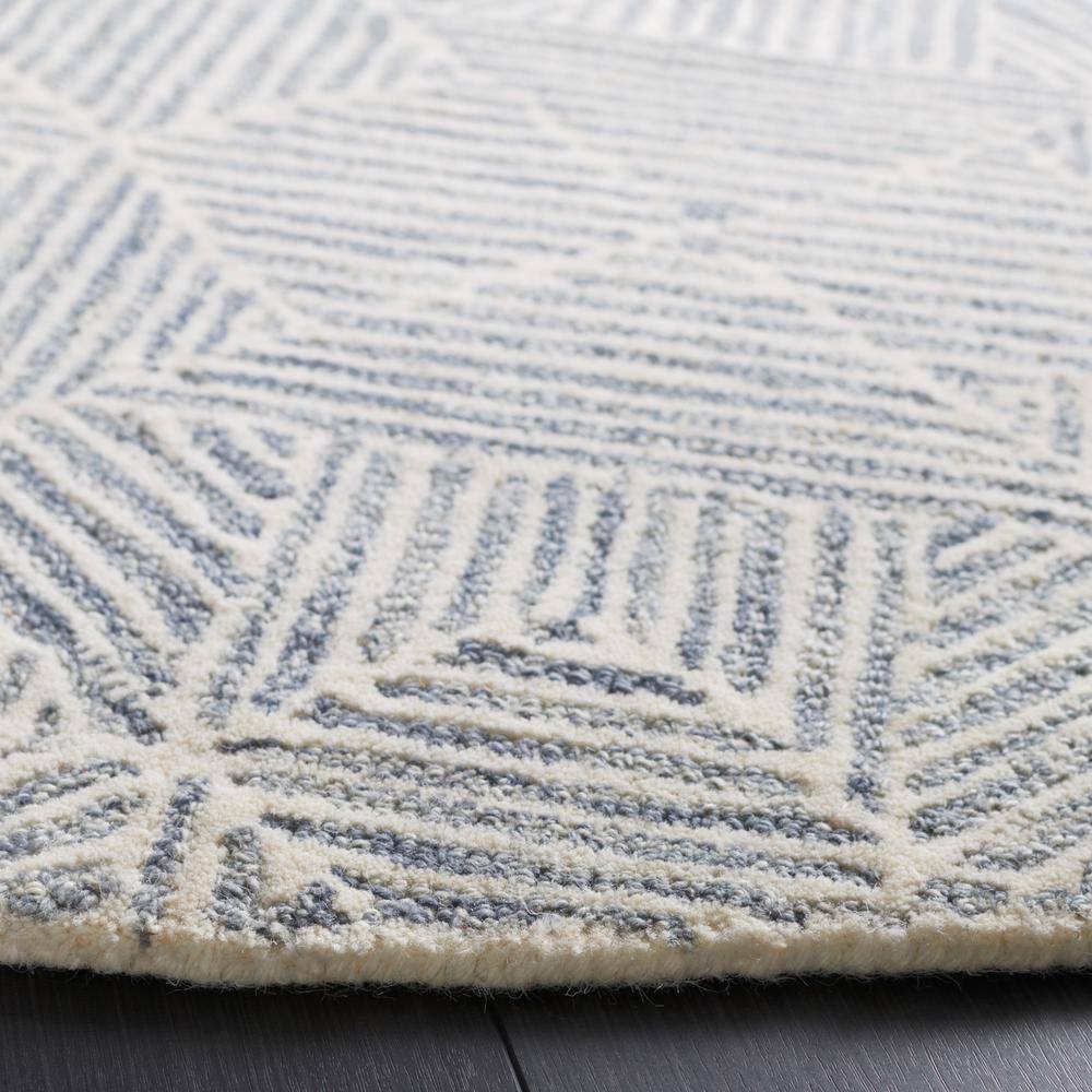 Grey and Ivory Round Tufted Wool Area Rug, 6' x 6'