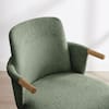 Close-up of the back of a green fabric stool.