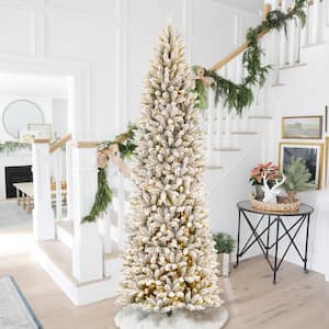 9 ft. Pre-Lit Flocked Pencil Fir Artificial Christmas Tree with 600 Warm White Lights