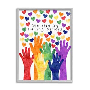 We Rise by Lifting Others Rainbow Hand Hearts by Erica Billups Framed Typography Art Print 30 in. x 24 in.