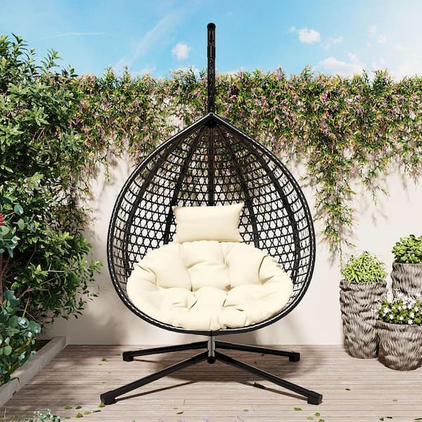 1-Person Black Wicker Patio Swing Egg Chair with Metal Stand and Beige Cushion for Balcony Garden Backyard