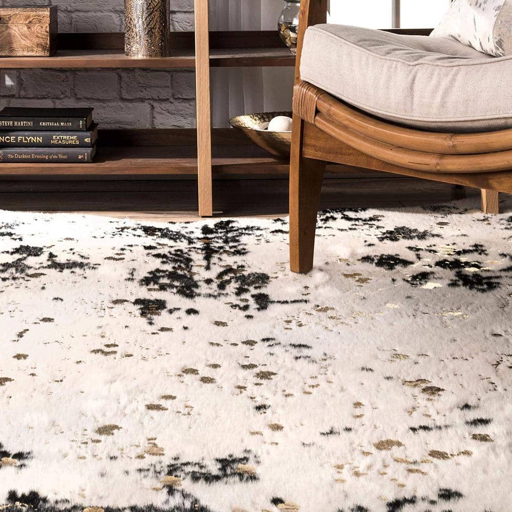 Black and Ivory Tufted Synthetic Cowhide Shaped Area Rug