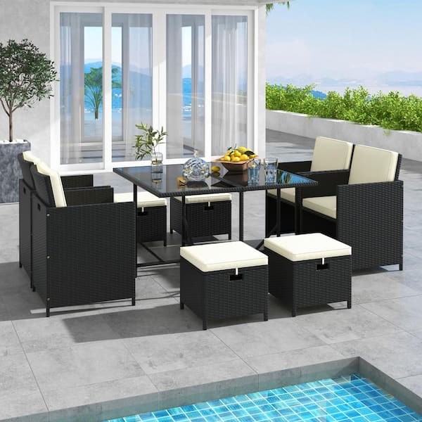 9 of Piece PE Wicker Outdoor Dining Set with Tempered Glass Table and Ottomans, White Cushions