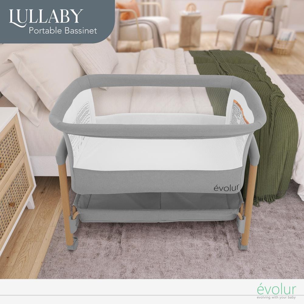 Light Gray Lullaby Portable Bassinet with wheels