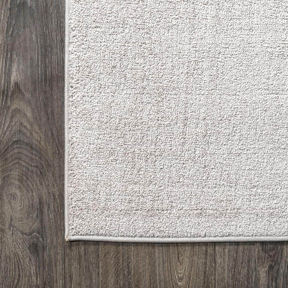 Ivory Solid Synthetic Low-Pile Rectangular Area Rug, 4' x 6'