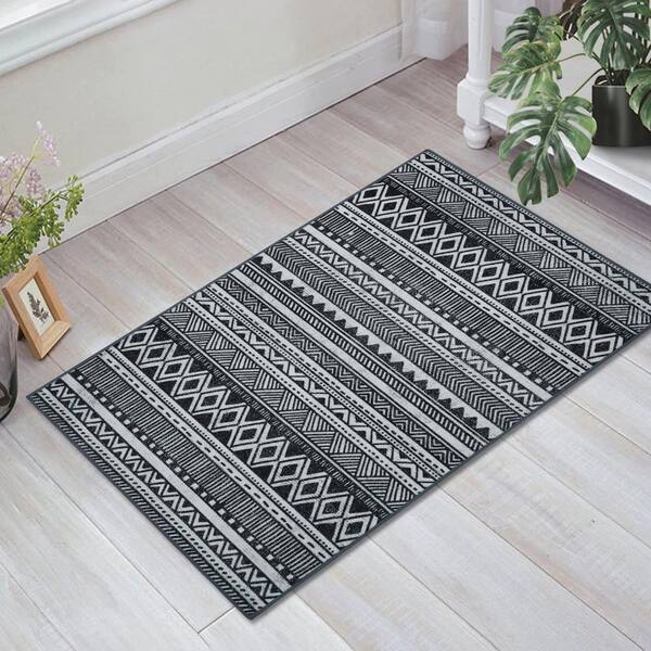 https://images.thdstatic.com/productImages/23f15ac9-abd0-484d-b98c-21b126bd56c2/svn/black-white-glowsol-area-rugs-ls-pho-0w93dcpa-e1_600.jpg