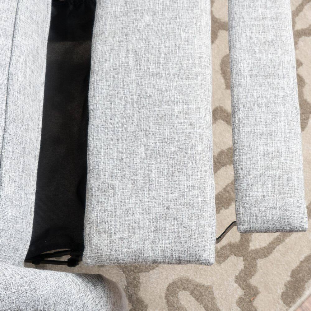 Close-up view of the light gray fabric upholstery and seat cushion.