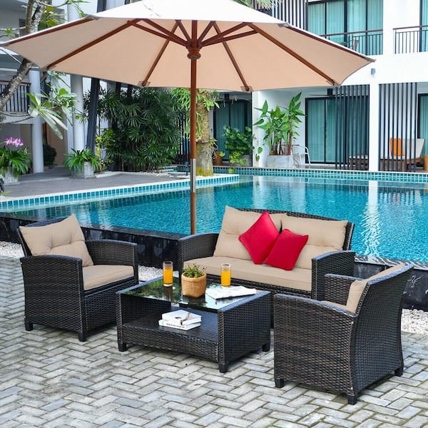 Brown Wicker Outdoor Chaise Lounge with Beige Cushions