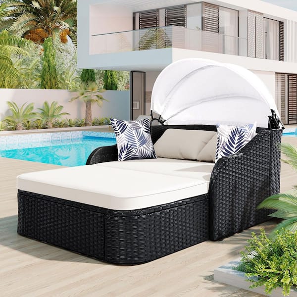 Black Wicker Outdoor Day Bed with Beige Cushions and Adjustable Canopy