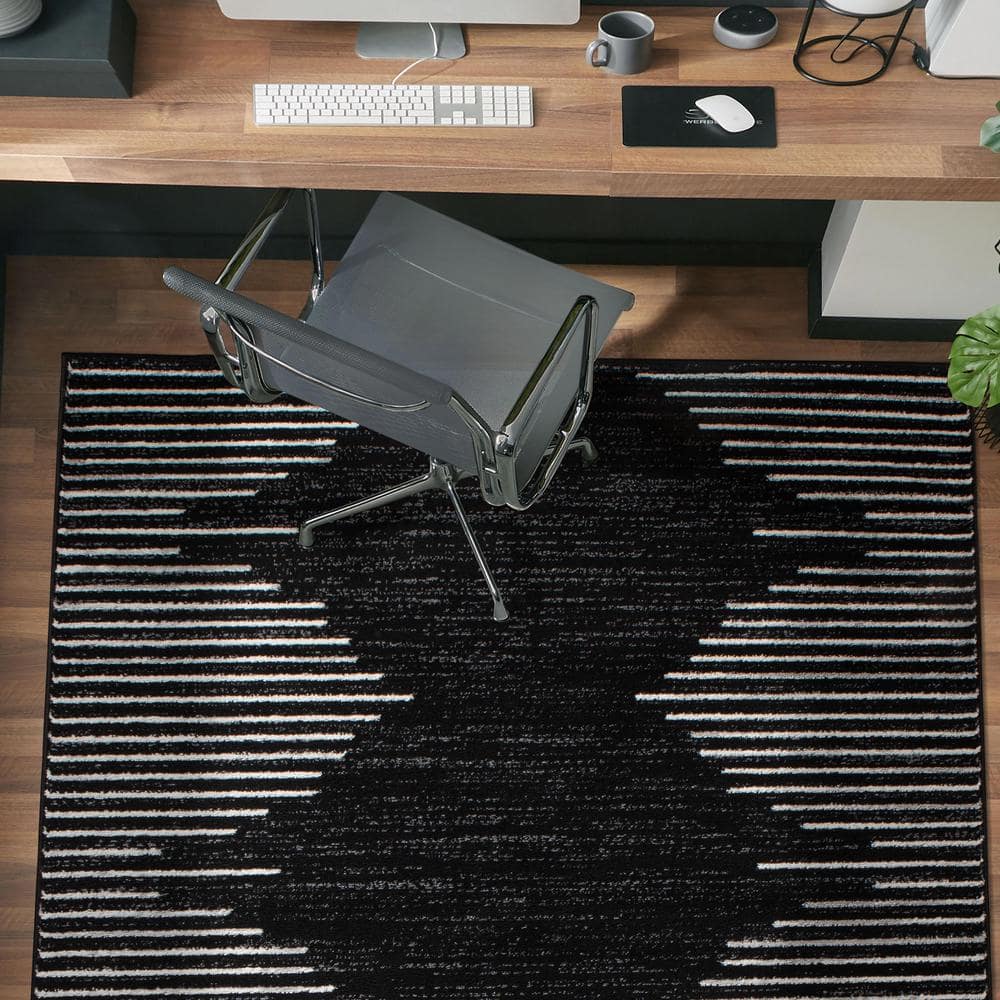 Black and White 5' x 7' Bohemian Stripe Synthetic Area Rug