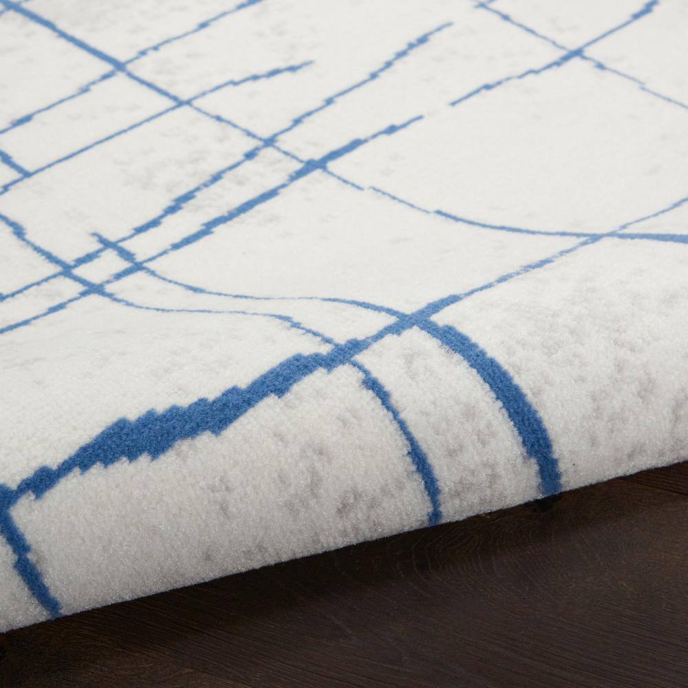 Ivory Abstract Linear 6' x 9' Machine-Made Synthetic Area Rug