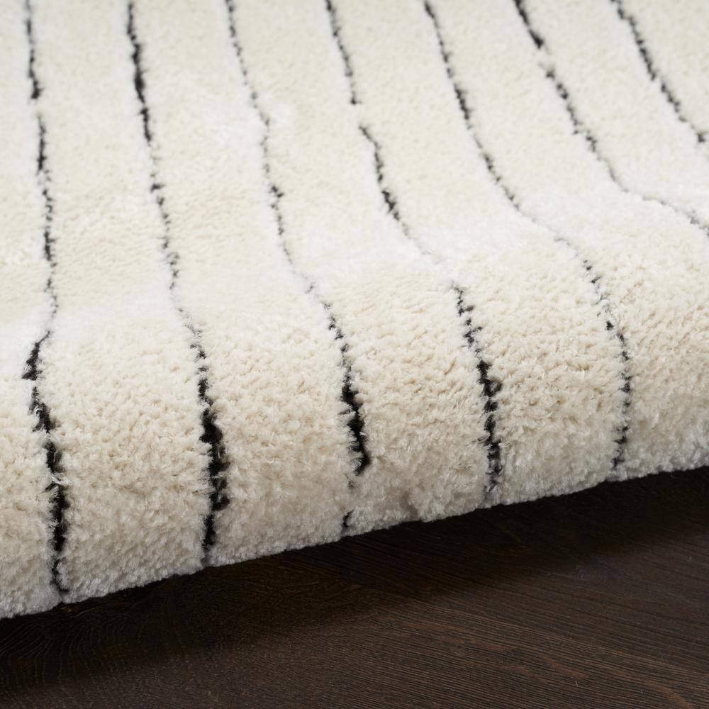 Ivory and Black Chevron Striped 5' x 7' Synthetic Area Rug