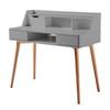 Three-quarter view of the light gray writing desk with wooden legs.