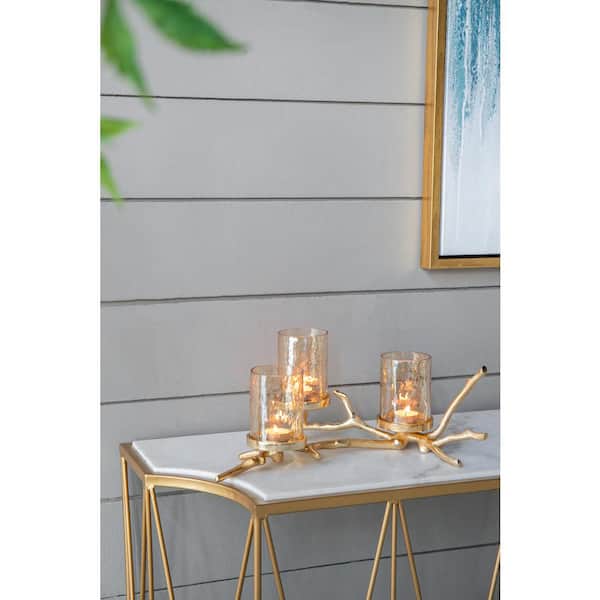 https://images.thdstatic.com/productImages/25249d1a-6a54-4249-a0c9-6733e19bb3f8/svn/gold-clear-a-b-home-candle-holders-78312-ds-64_600.jpg