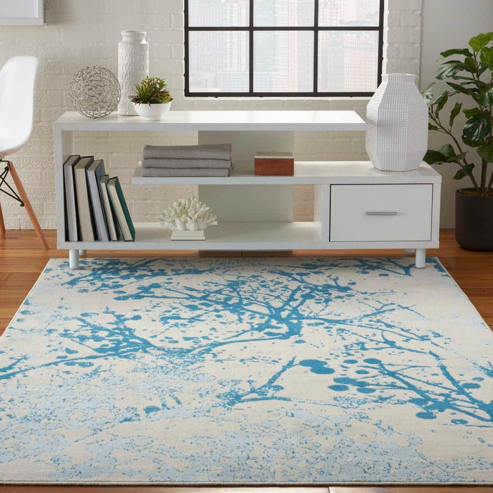 Ivory and Blue Abstract Synthetic 4' x 6' Easy-Care Area Rug