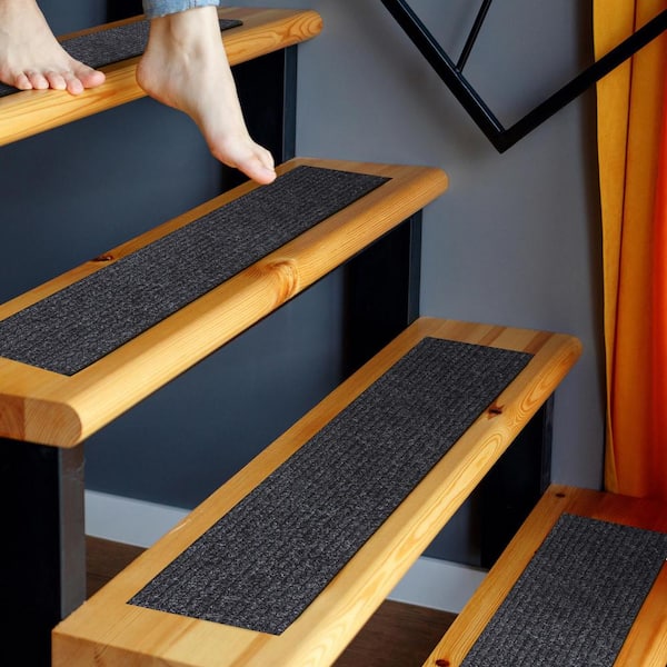 https://images.thdstatic.com/productImages/258aed06-de21-473f-9e0a-d6f5c518c1ac/svn/black-ottomanson-stair-tread-covers-srt704-14-4f_600.jpg