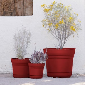 Saturn 9.75 in. Burnt Red Plastic Planter with Saucer