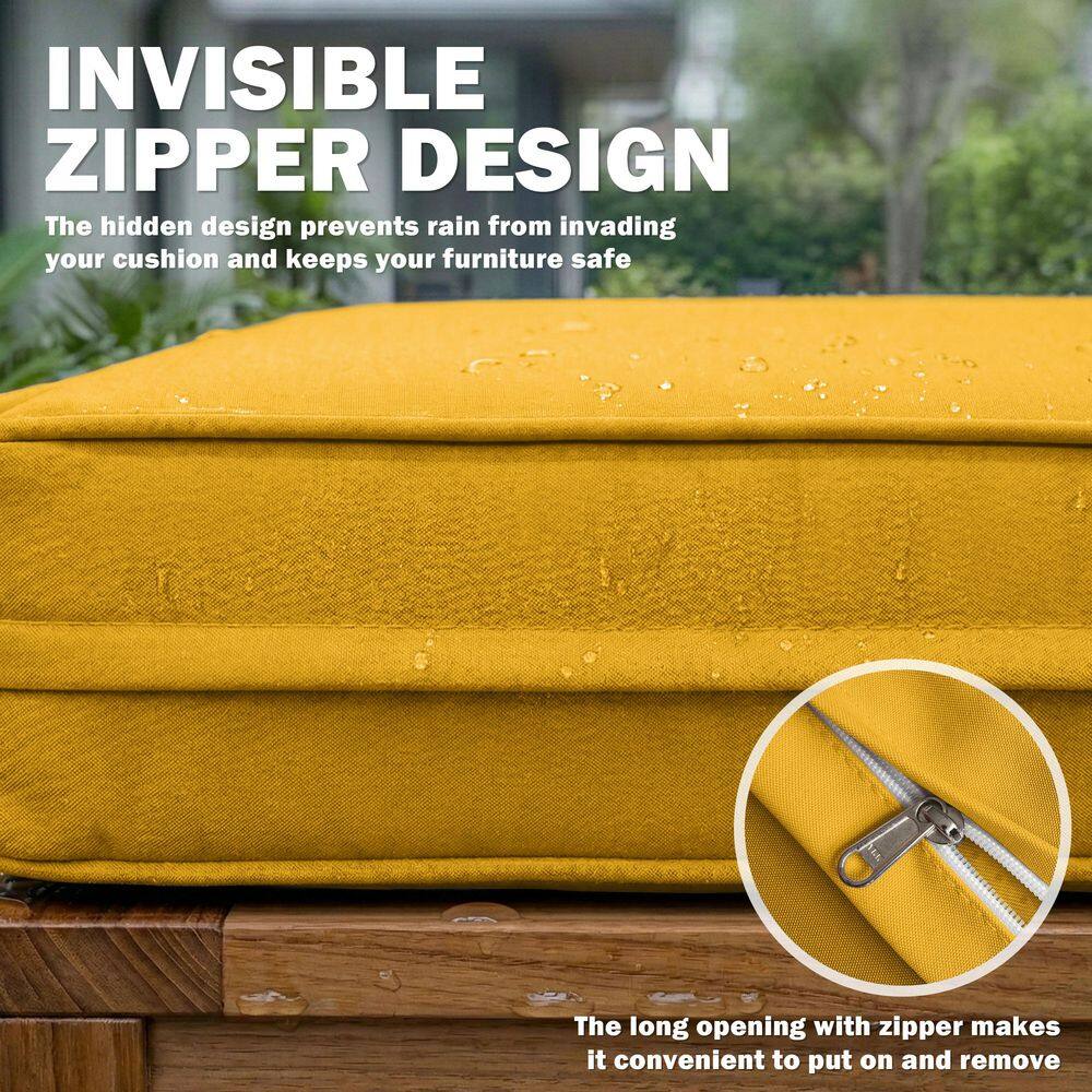 Close-up of the invisible zipper on a yellow cushion cover.