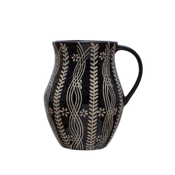 Storied Home 8.5" 64 fl.oz Black and Natural Stoneware Pitcher with Wax Relief Botanicals