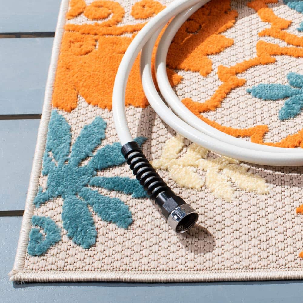 Ivory and Blue Floral Synthetic Indoor/Outdoor Rug