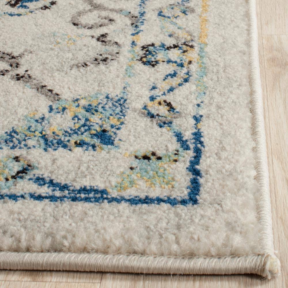 Ivory and Blue Floral Motif Synthetic Area Rug