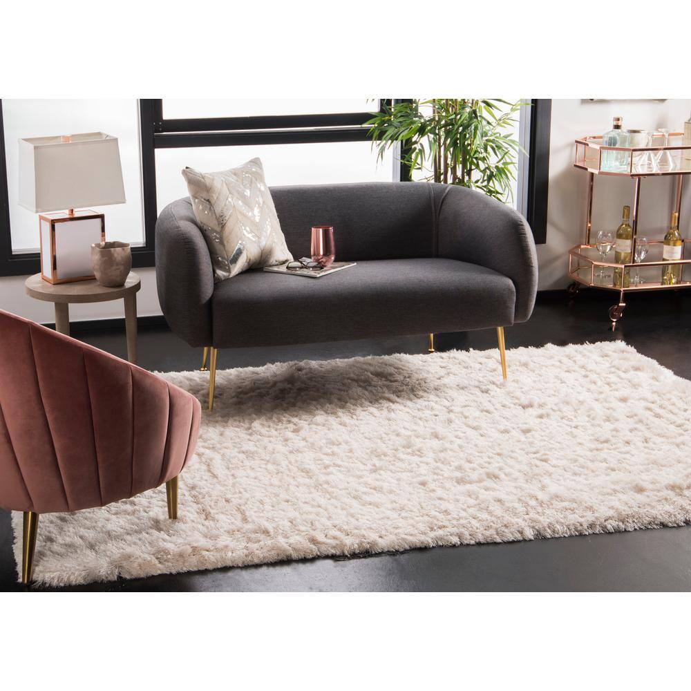 Ivory Tufted Shag 5' x 7' Wool and Synthetic Rug