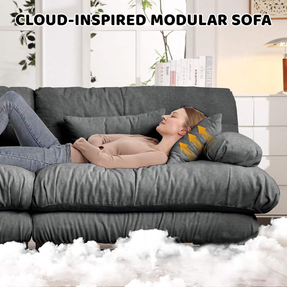 Woman relaxing comfortably on a modular sofa with soft cushions.
