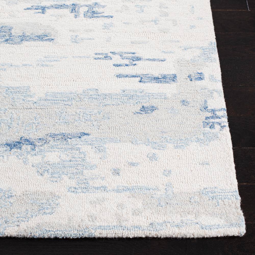 Ivory and Blue Abstract Hand-Tufted Wool 8' x 10' Rug