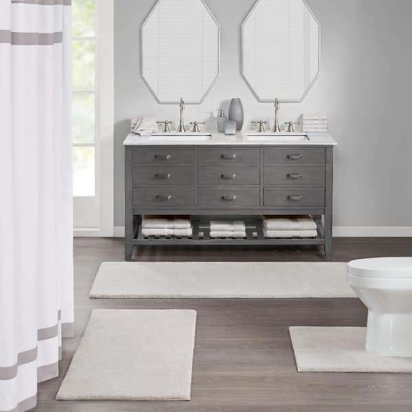 https://images.thdstatic.com/productImages/27075da7-f296-471a-95a0-1617f4f2279a/svn/taupe-bathroom-rugs-bath-mats-mps72-386-c3_600.jpg