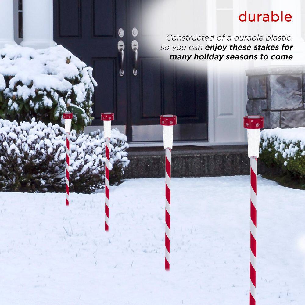 Alpine Corporation 27" Striped Plastic Solar Light-Up Holiday Garden Stakes, Set of 4, Red/White
