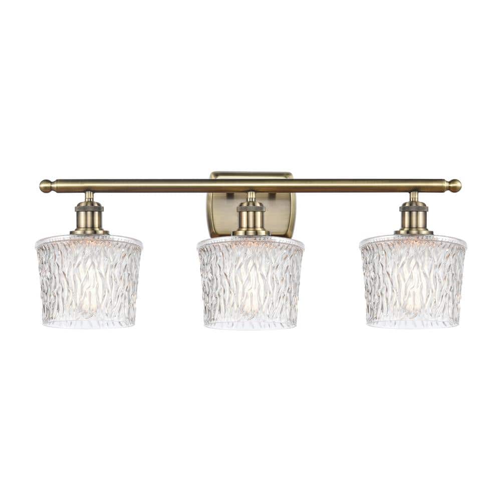 Niagra 26 in. 3-Light Antique Brass, Clear Vanity Light with Clear Glass Shade price history on PriceWatchPro