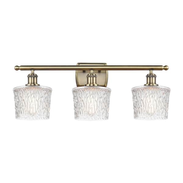 Niagra 26 in. 3-Light Antique Brass, Clear Vanity Light with Clear Glass Shade