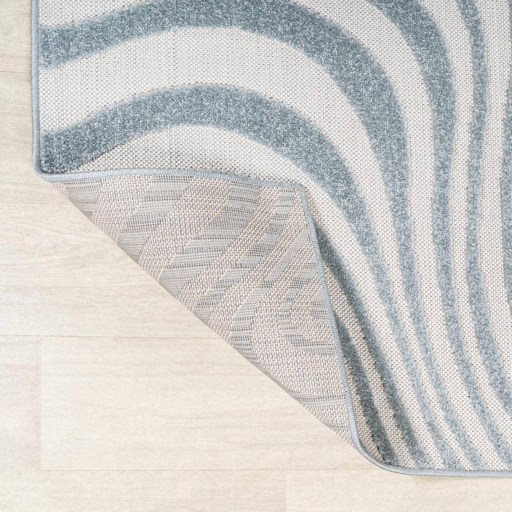 Light Blue and Ivory Abstract 4' x 6' Synthetic Area Rug
