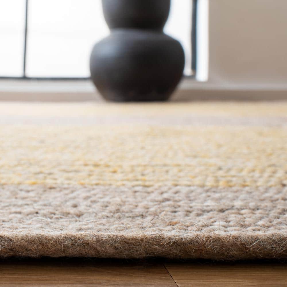 Handmade Gold and Beige Round Wool Braided Rug