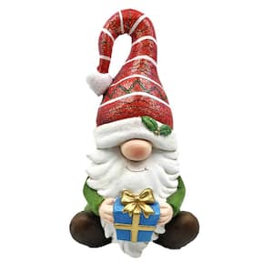 19 in. Tall Christmas Gnome Sitting with Gift and Red Striped Hat