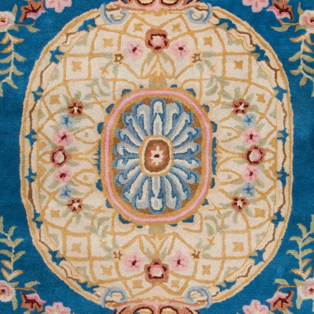 Handmade Blue and Ivory Floral Wool 8' x 10' Area Rug