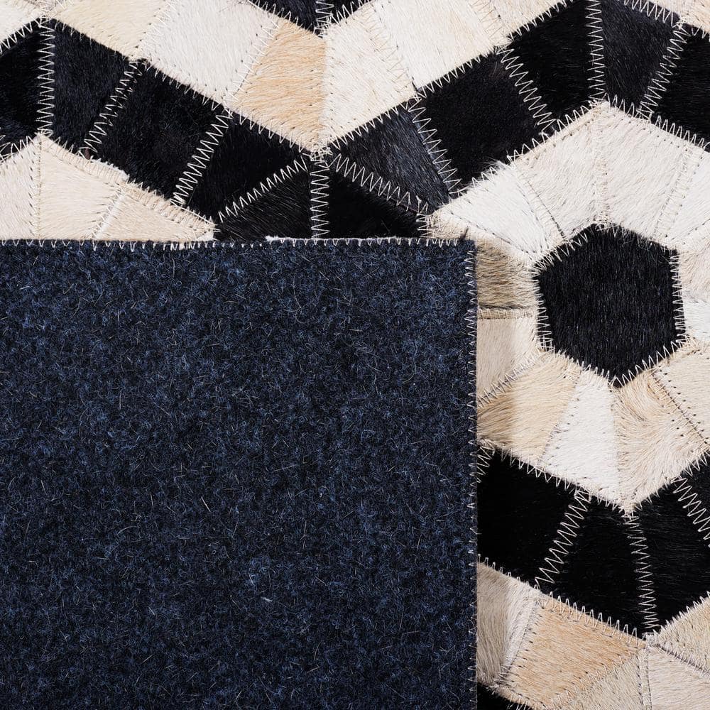 Handmade Black and Beige Geometric Cowhide Area Rug