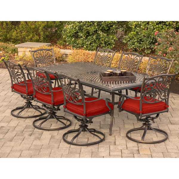 Hanover Traditions 9-Piece Aluminum Outdoor Dining Set with Swivel Rockers with Red Cushions