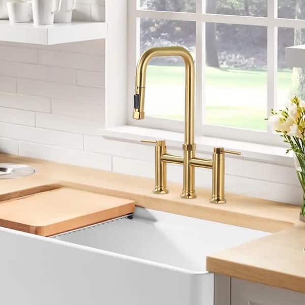 Double-Handle Bridge Kitchen Faucet with Pull-Down Sprayhead and 360° High-Arc Spout in Gold