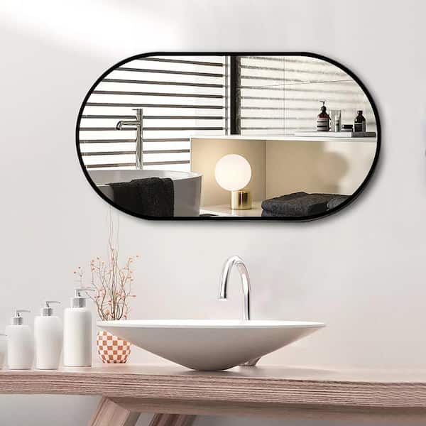 36 in. W. x 18 in. H Oval Framed Wall Bathroom Vanity Mirror in Black